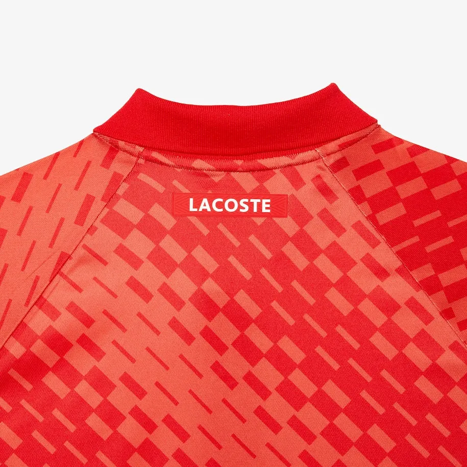 Lacoste Tennis x Novak Djokovic Fan Version Polo Rot / Orange
